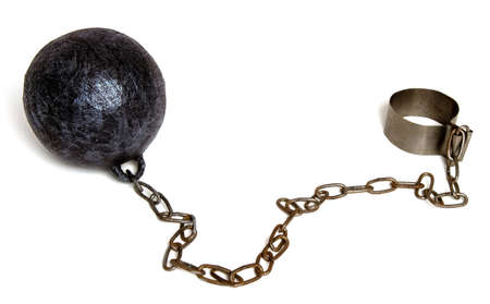 Heavy metal ball on a chain and a fastener for a prisoner or slave isolated on white backgroundの写真素材