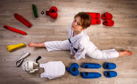 Conceptual image in flat lay style of a little karateka girl surrounded by her equipment necessary for training and competitionの写真素材