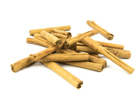 Cinnamon sticks on white