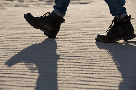 two boots in the sand at beachの写真素材