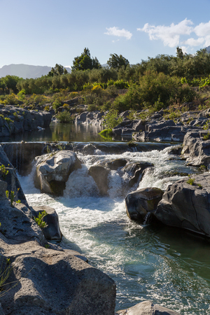 A waterfall creek Alcantara Sicilyの写真素材