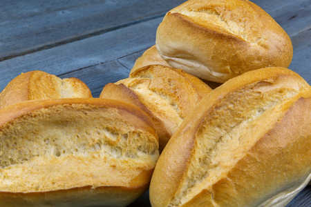 Several rolls lie on a wooden boardの写真素材