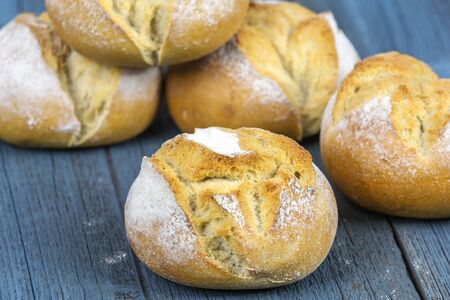 Several rolls lie on a wooden boardの写真素材