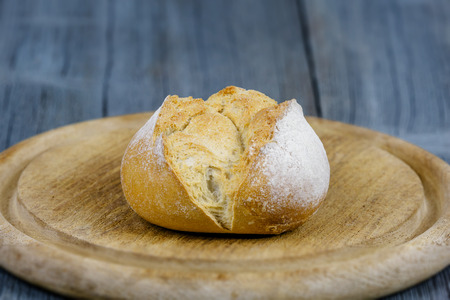 A bun is on a wooden boardの写真素材