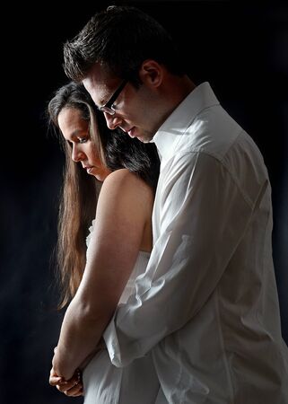 Portrait of a young couple embracingの写真素材