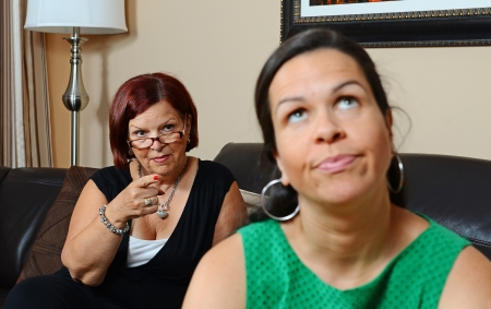 Image of a mother looking angry at her daughterの写真素材