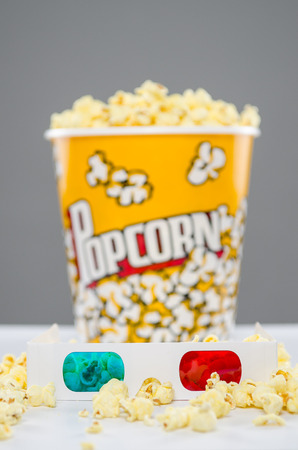 3d glasses with popcorn in backgroundの写真素材