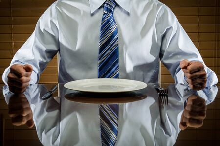 Man with empty plateの写真素材