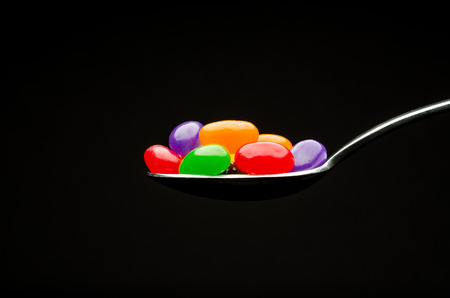 Spoon with jelly beansの写真素材
