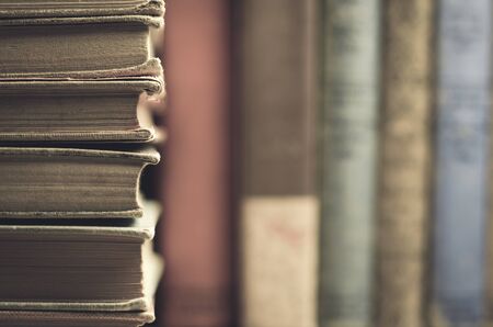 Antique style books on shelfの写真素材