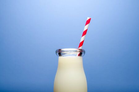 Milk on blue backgroundの写真素材