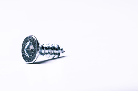 Close up of screw on white