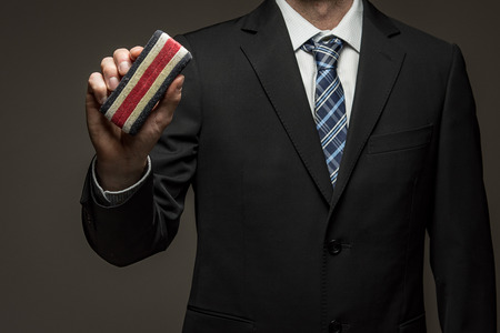 Man wearing suit holding eraserの写真素材