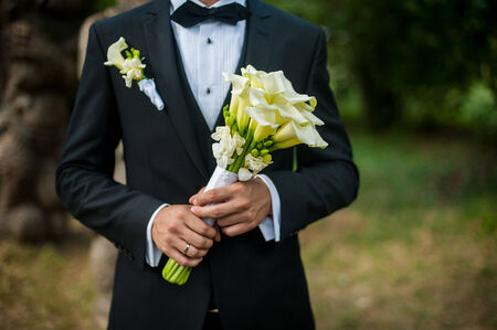 beautiful bride with a bouquet of liliesの写真素材