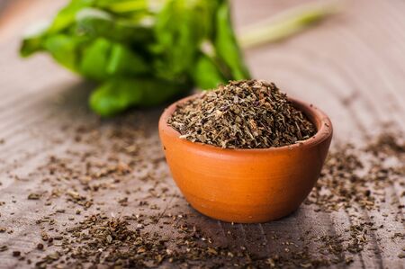 A pot of basil on a woodenの写真素材
