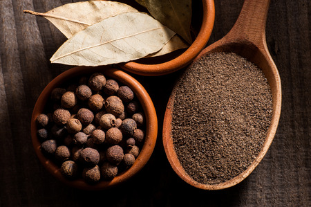 A mixture of peppers, allspice, black pepper, bay leafの写真素材