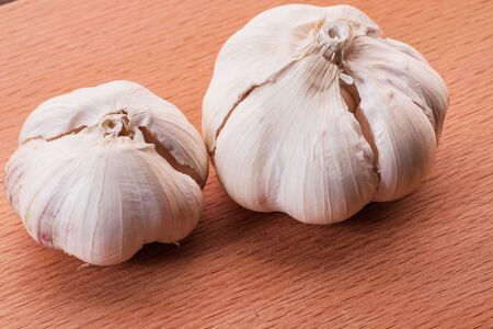 garlic on wooden surfaceの写真素材
