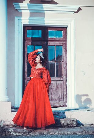 Beautiful girl posing near the old palace, dynamics, top-downの写真素材