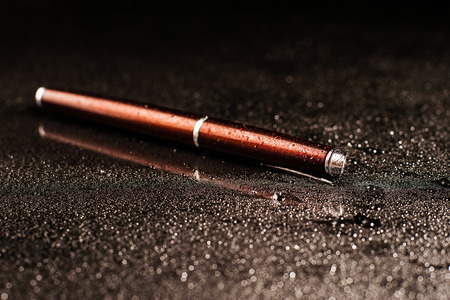 pen on black background.Creative ideas for advertisingの写真素材