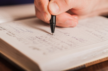 businessman writes in a notebook, routine, business planの写真素材