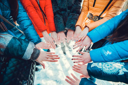 Hands of young people in the winter, team conceptの写真素材