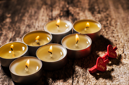 Red candles light with rose.Valentine candle lights.Six, three, two candlesの写真素材