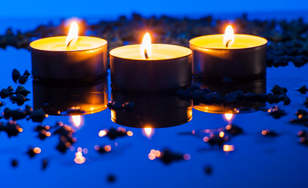 Happy Valentine's Day.Beautiful place setting for Valentine's Day.Candle  on sand with sea and sunset backgroundの写真素材