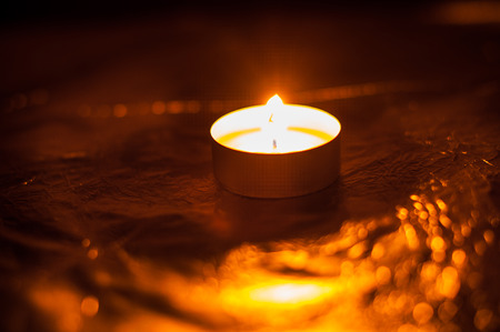 Single lit candles.One candleの写真素材