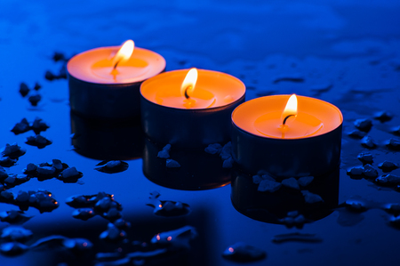 Happy Valentine's Day.Beautiful place setting for Valentine's Day.Candle  on sand with sea and sunset backgroundの写真素材