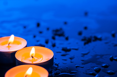Happy Valentine's Day.Beautiful place setting for Valentine's Day.Candle  on sand with sea and sunset backgroundの写真素材
