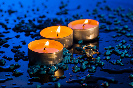Happy Valentine's Day.Beautiful place setting for Valentine's Day.Candle  on sand with sea and sunset backgroundの写真素材