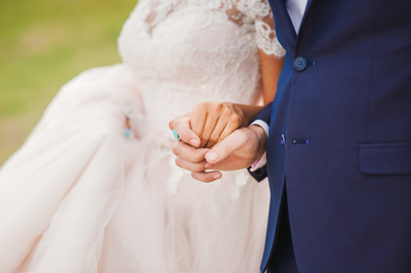 wedding couple holding hands, love, respect, sense.wedding dress, suitの写真素材