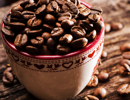 Fresh-ground coffee beans.Coffee beans on wooden textureの写真素材