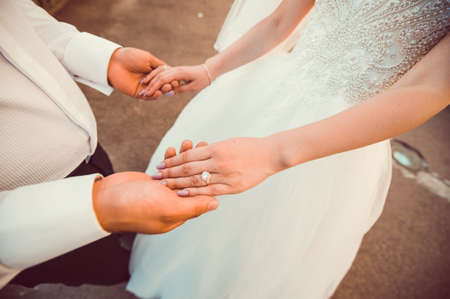 a young couple holding hands.Two people united in natureの写真素材
