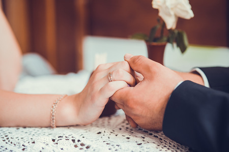 bride and groom holding hands.Declaration of Loveの写真素材