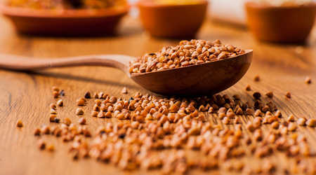     buckwheat on the table. Buckwheat seeds in spoonの写真素材