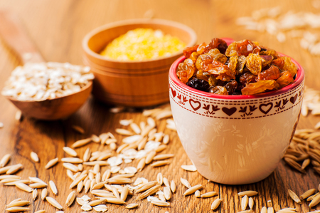   oatmeal spoon.Oatmeal in bowl and scoop.Dry oat flakes oatmealの写真素材