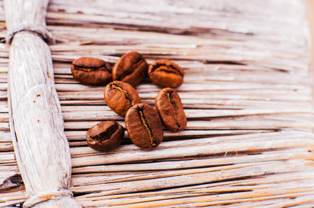 Aromatic coffee beans. Coffee beans in a wooden scoop.Fresh aromatic coffee
