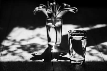 Glass of water on the table water droplets, power energy.の写真素材