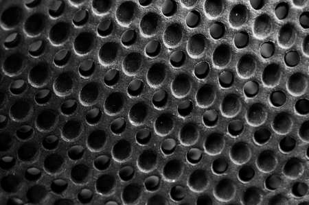 Close up of perforated metal texture background. Black and whiteの写真素材