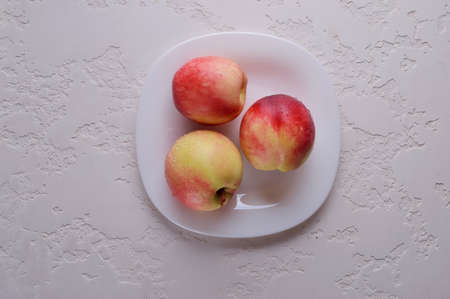 Delicious nectarines on the table. Vitamins are useful.の写真素材