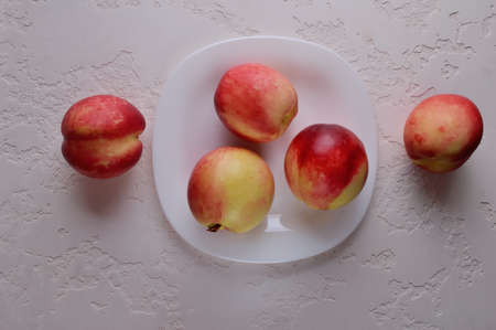 Delicious nectarines on the table. Vitamins are useful.の写真素材