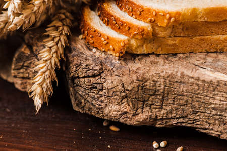 Photos ground flour. Fresh wheat grains and flour.Slices of breadの写真素材