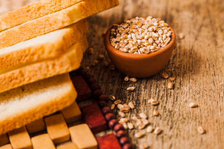 Photos ground flour. Fresh wheat grains and flour.Slices of breadの写真素材
