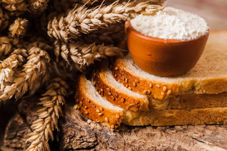 fresh wheat grains and flour.Slices of breadの写真素材