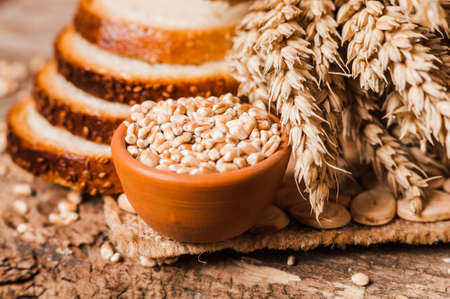 fresh wheat grains and flour.Slices of breadの写真素材