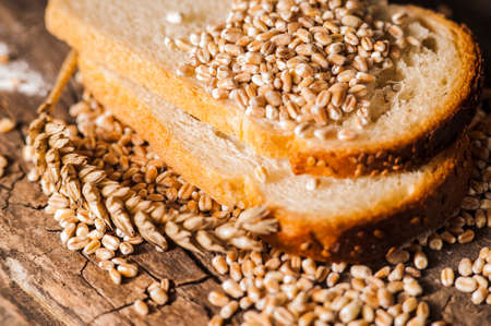 Photos ground flour. Fresh wheat grains and flour.Slices of breadの写真素材