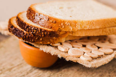 Photos ground flour. Fresh wheat grains and flour.Slices of breadの写真素材