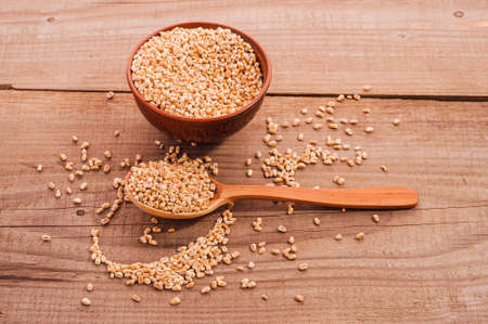 wheat bowl on wooden tableの写真素材