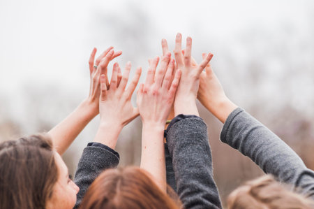 Hands of young people in nature, team conceptの写真素材